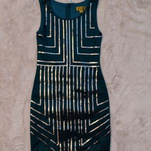Dark green mini dress with gold sequins.